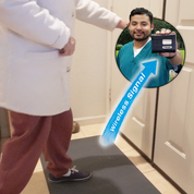 Floor mat exit alarm for the elderly. Elderly women activating floor mat sensor to caregiver pager by walking out front door